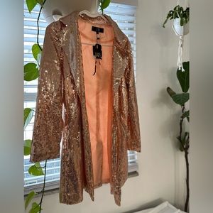 Shimmer with this rose gold sequined Lucky & Blessed brand blazer.